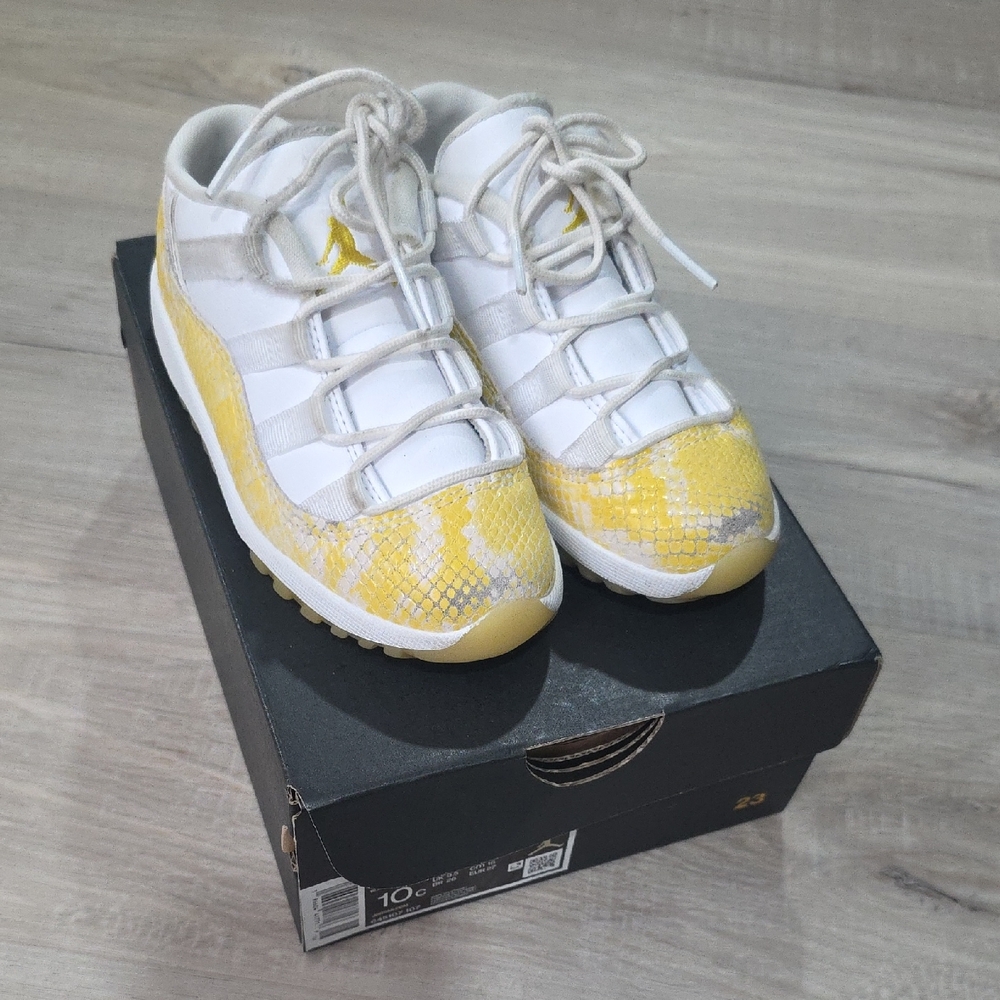 Jordan 11 Retro Low in White and Tour Yellow